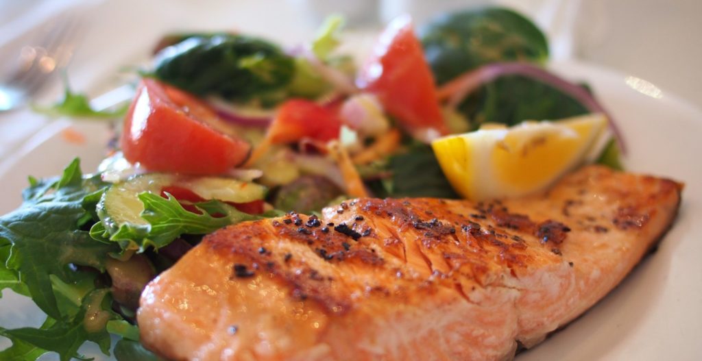 Plate of salmon and veggies. healthy healthcare food