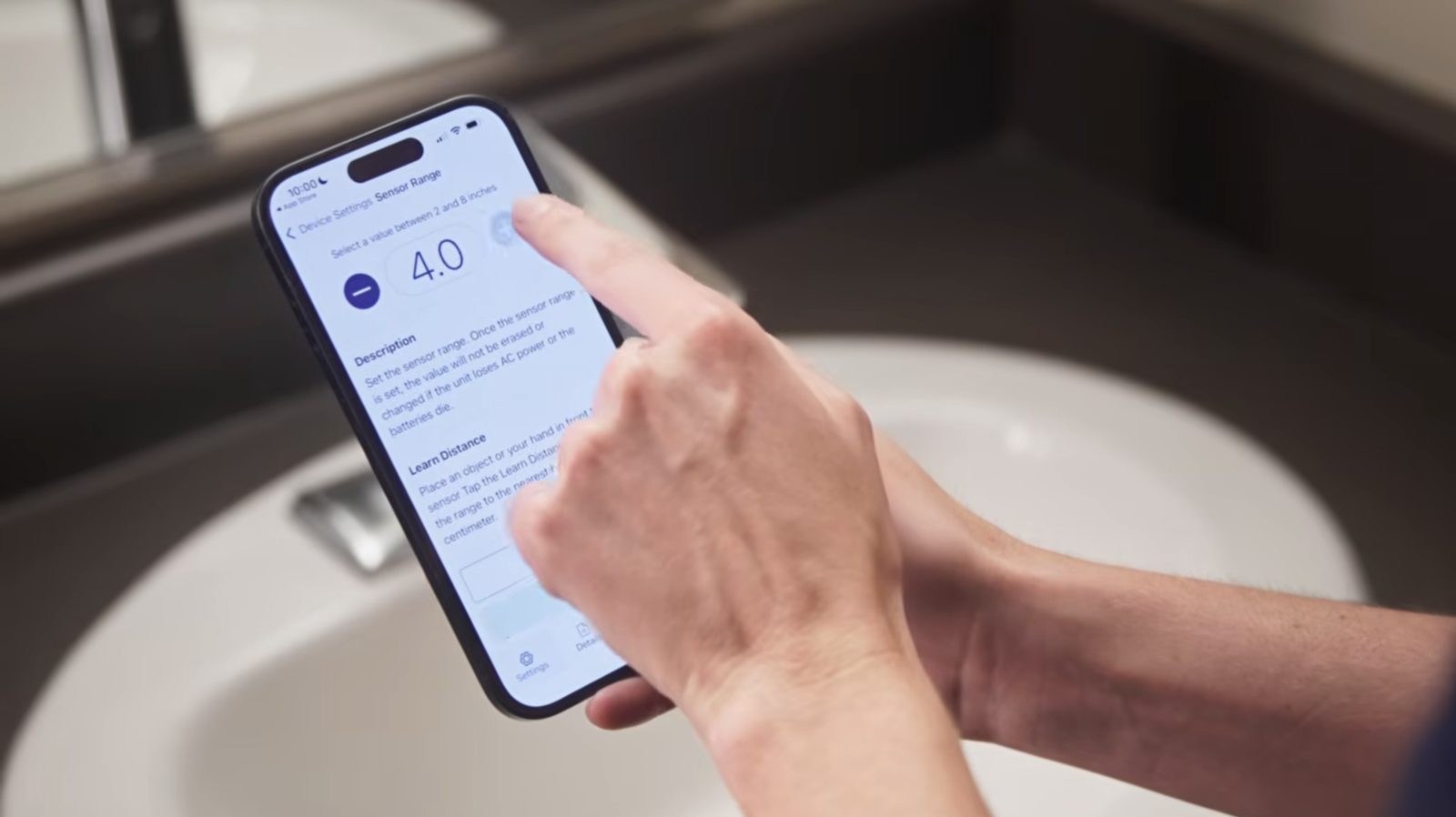 The T&S LYNC mobile app configuring a WaveCrest sensor faucet at the sink